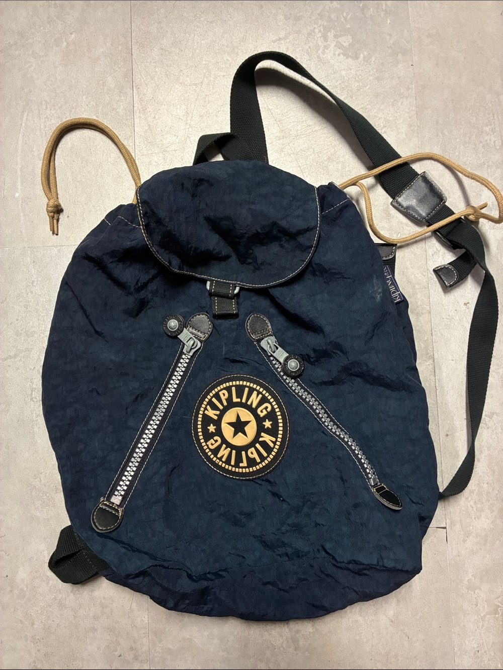Kipling Navy Blue Drawstring Canvas Backpack with Tan Accents